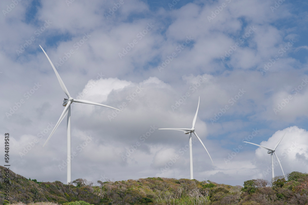 Panoramic view of a wind farm or wind farm with tall wind turbines to generate electricity. Green energy concept. Panoramic view of a wind farm or wind farm with tall wind turbines to generate electricity. Green energy concept.