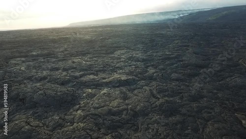 Wallpaper Mural Hawaii lava field with smoking lava flow in the background aerial view Torontodigital.ca