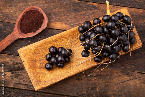 Acai berry powder in spoon - Euterpe oleracea photo