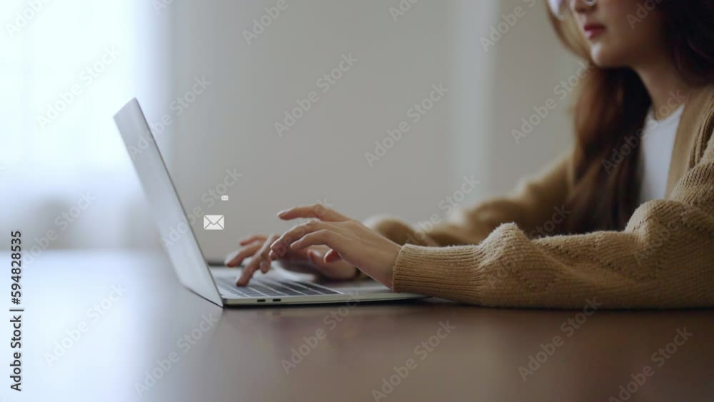 Email marketing and newsletter concept. Hand of woman using computer laptop and sending online message with email icon
