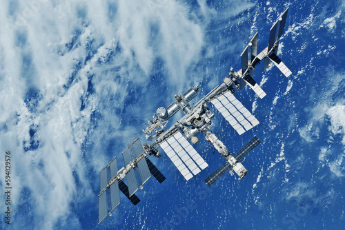 Fototapeta Naklejka Na Ścianę i Meble -  International Space Station above the Earth. Elements of this image furnished by NASA