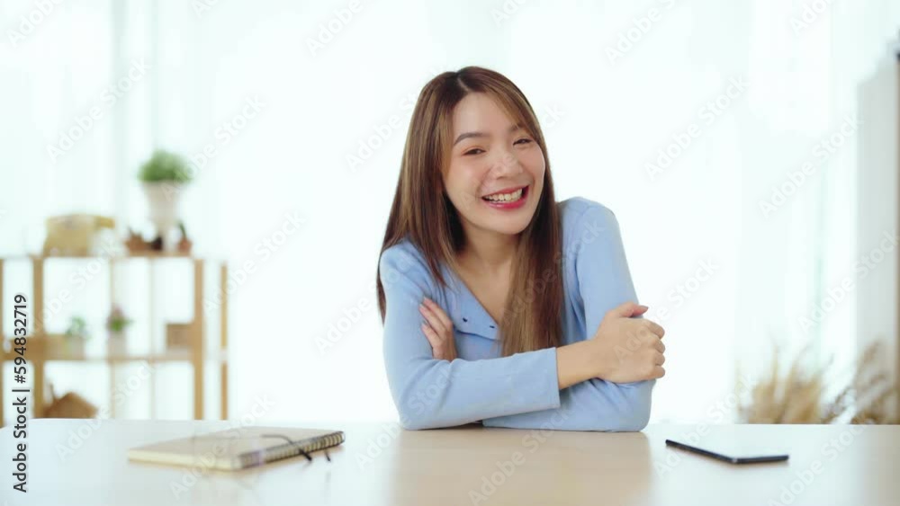 Happy teen asian girl blogger smiling face waving hand talking to webcam recording vlog, social media influencer streaming, making video call at home. Headshot portrait. Webcam view Happy teen asian girl blogger smiling face waving hand talking to webcam recording vlog, social media influencer streaming, making video call at home. Headshot portrait. Webcam view