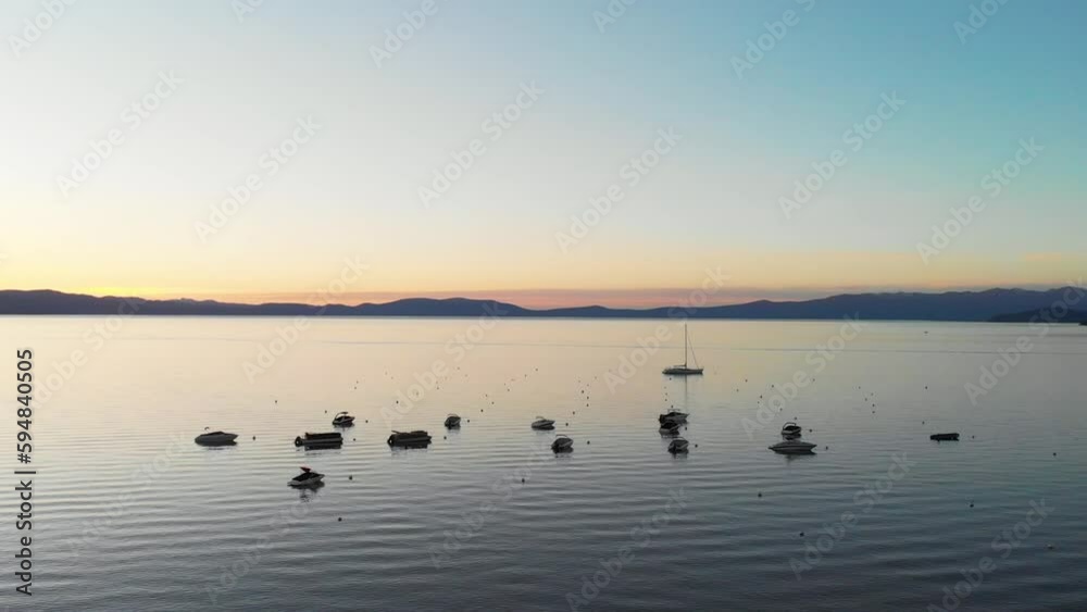 Anchored boats at sunset in Lake Tahoe Anchored boats at sunset in Lake Tahoe
