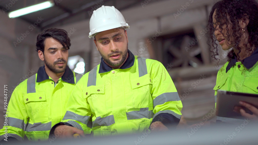 Group of professional mechanical engineer or technician working together in the factory and making a handshake after finished working. Group of professional mechanical engineer or technician working together in the factory and making a handshake after finished working.