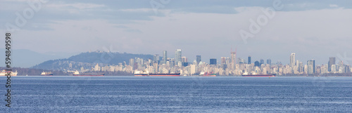 Downtown Vancouver City Skyline on the West Coast of Pacific Ocean. Cloudy Sunset. British Columbia, Canada. © edb3_16