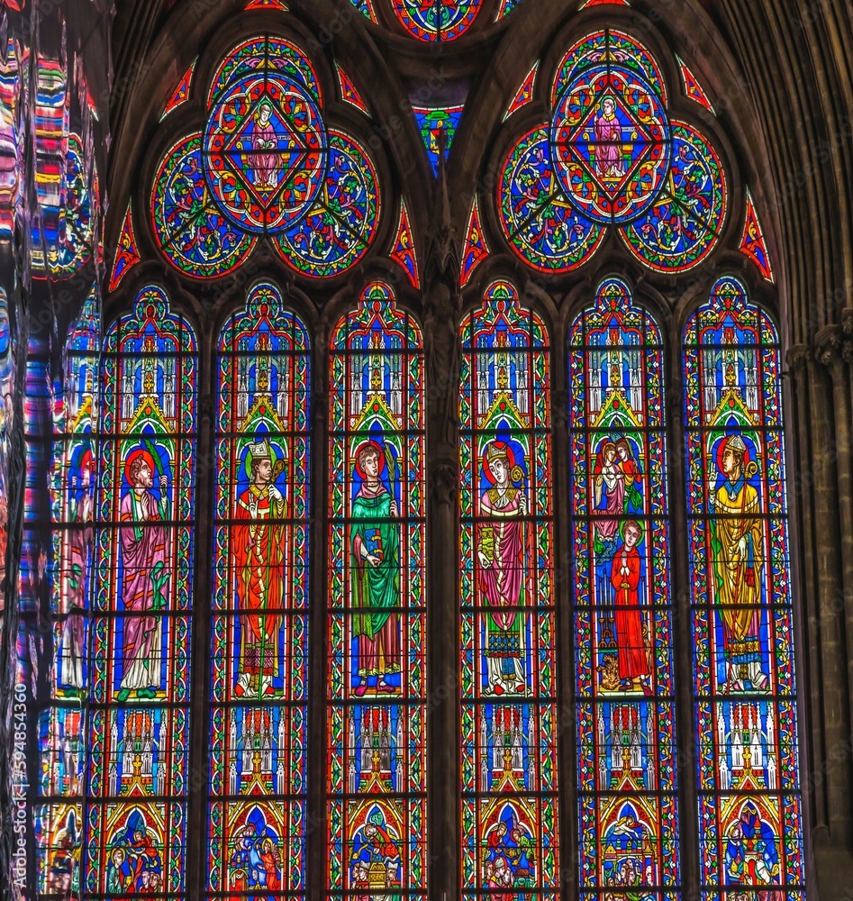 Colorful Saints Bishops stained glass reflection, Bayeux Cathedral, Normandy, France. Catholic church consecrated 1077