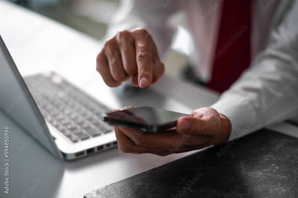 Close up of business man hand using smart phone and tablet. business and technology concept Close up of business man hand using smart phone and tablet. business and technology concept