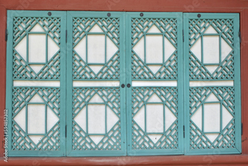 Green traditional korean wooden window, closeup of photo with selective focus