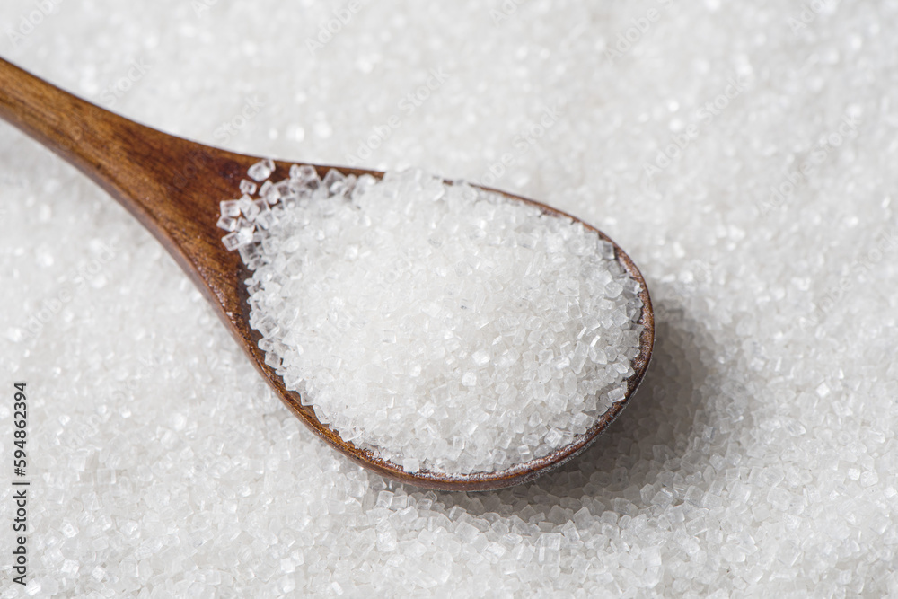 white sugar in spoon texture background. white sugar in spoon texture background.