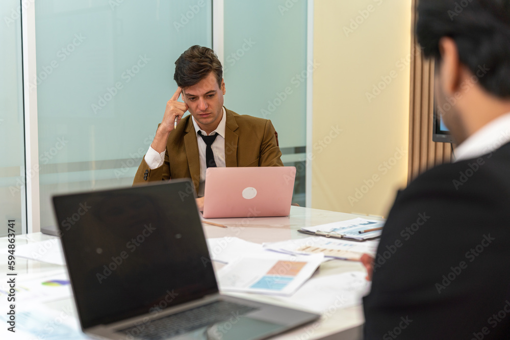 Team work. Businesswoman and man working and having a discussion in the meeting room Team work. Businesswoman and man working and having a discussion in the meeting room