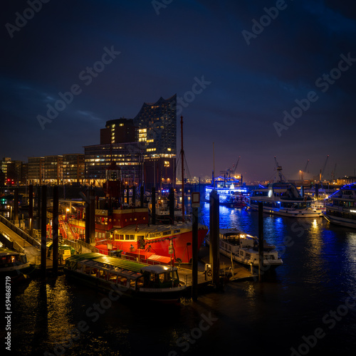 the illuminated port of Hamburg at night