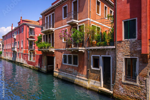 Old facades of buildings in Venice viewed from a bridge