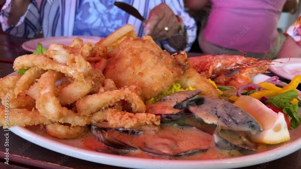 Seafood being served at a busy restaurant Seafood being served at a busy restaurant