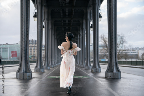 Woman portrait under Bir Hakeim bridge. Paris, France.