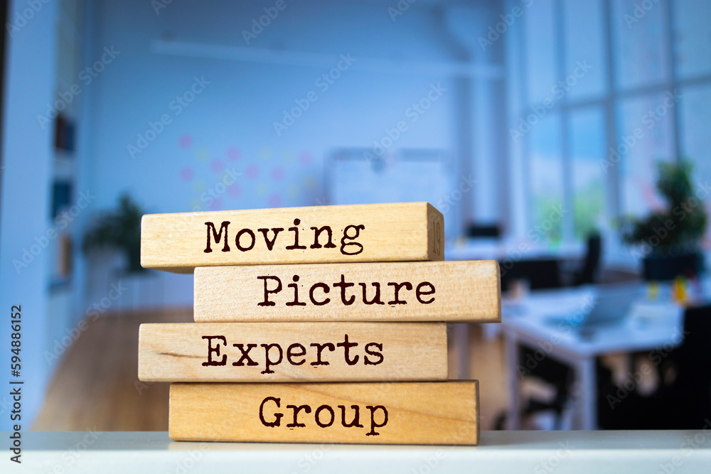 Wooden blocks with words 'Moving Picture Experts Group'.