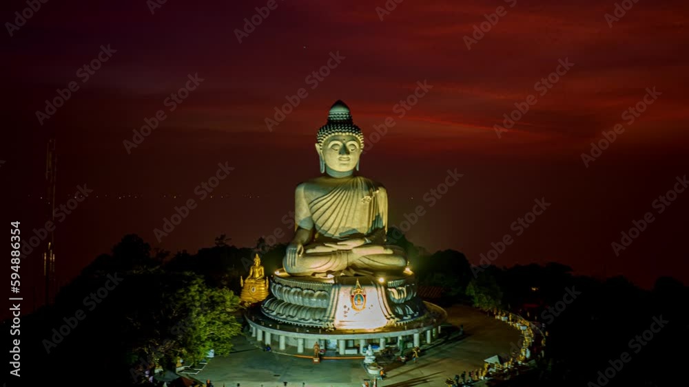 aerial Hyperlapse day to night amazing sky view at Phuket big Buddha ..important and revered landmarks on hill top of Phuket island..colorful sky day to night beautiful nature background