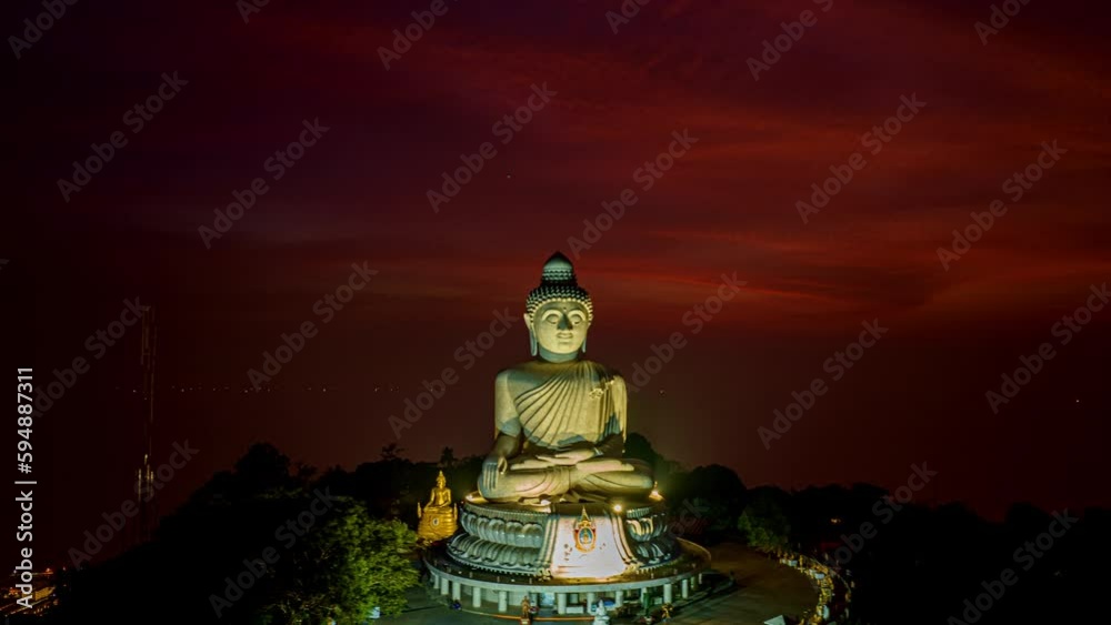 aerial Hyperlapse day to night amazing sky view at Phuket big Buddha ..important and revered landmarks on hill top of Phuket island..colorful sky day to night beautiful nature background