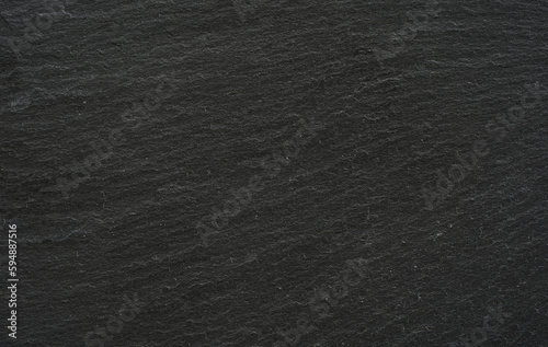dark grey black slate stone texture background. close up dark grey black slate stone texture background. black slate stone texture