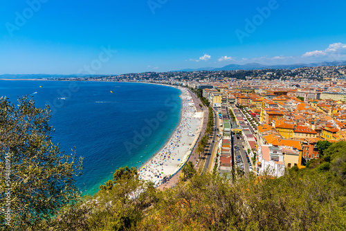 Nice panorama with Vieille Ville old town district, Promenade des Anglais boulevard and beach at French Riviera of Mediterranean Sea in France photo