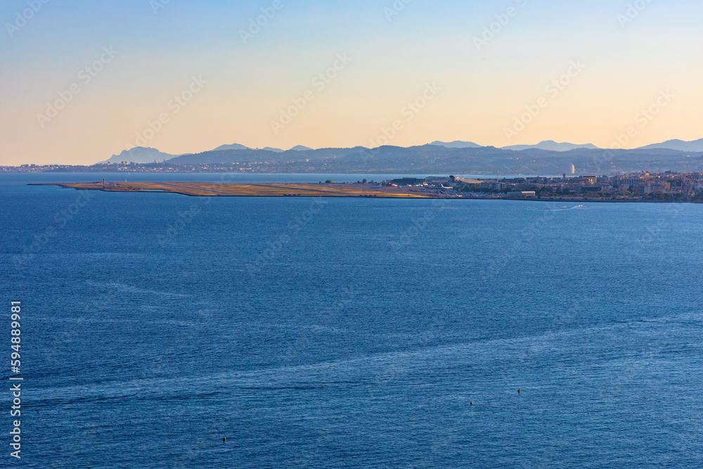 Nice seashore landscape with Cote d'Azur airport at French Riviera of Mediterranean Sea in France