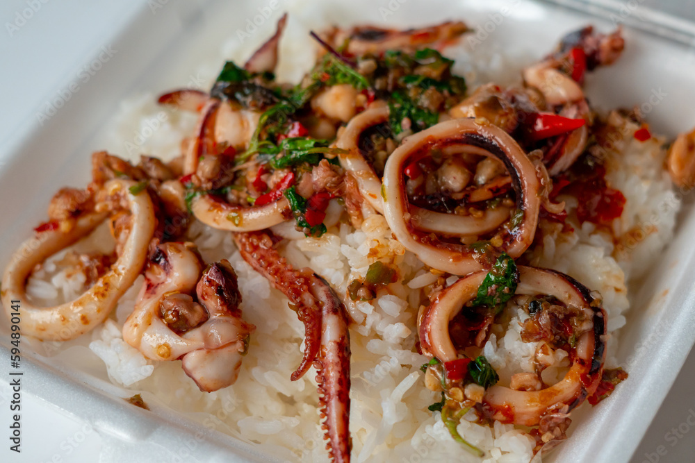 stir fried holy basil with octopus or squid and herb - Asian food style stir fried holy basil with octopus or squid and herb - Asian food style