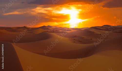 Beautiful sand dunes in the Sahara desert at sunrise with solar eclipse - Sahara, Morocco