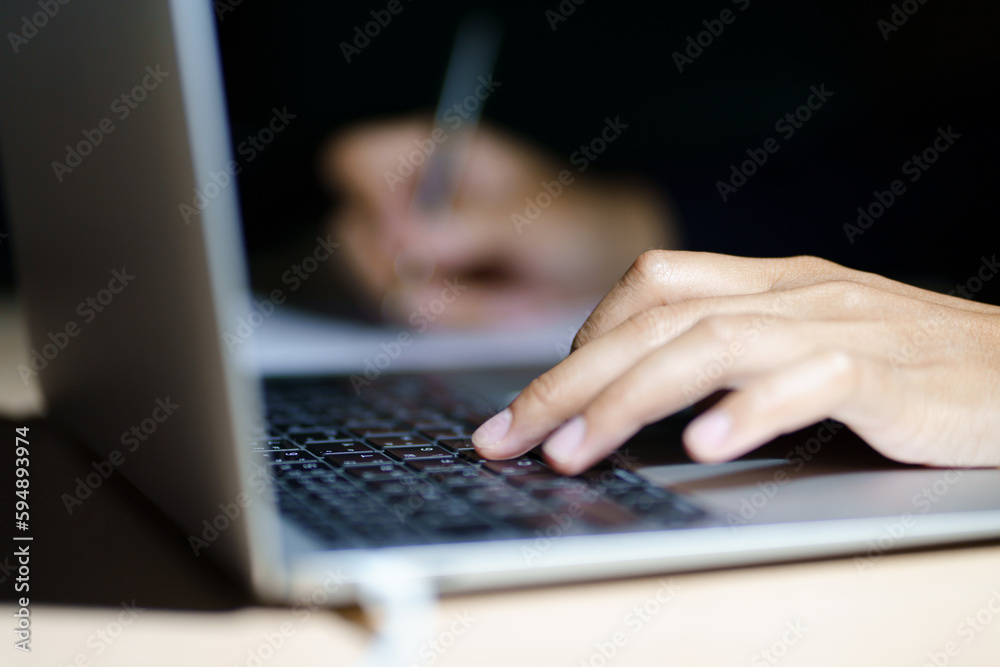 Close up of a man's hands on keyboard of lap top in the dark room, people working at home, modern white notebook. Internet, work, technology concept. Close up of a man's hands on keyboard of lap top in the dark room, people working at home, modern white notebook. Internet, work, technology concept.