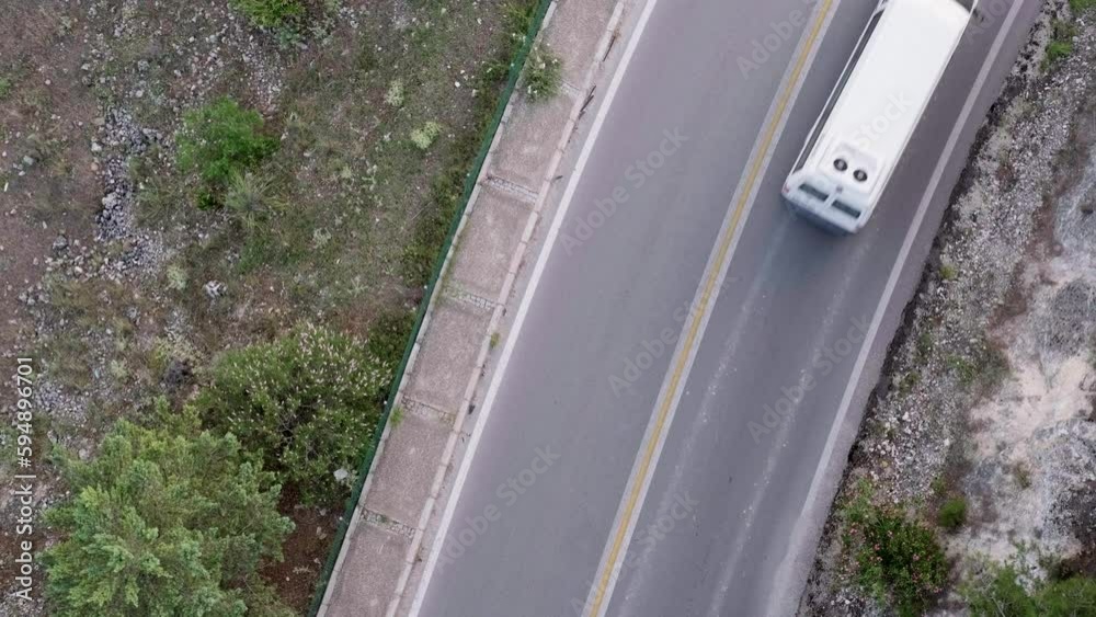 Aerial top view road going through green forest, view cars on road, traveling. Aerial top view road going through green forest, view cars on road, traveling.