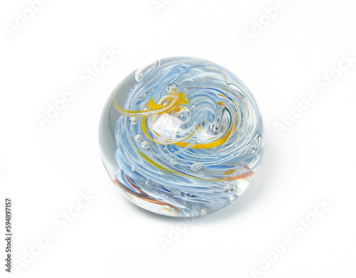 Glass ball isolated on white background. Decorative ball with swirl geometry inside