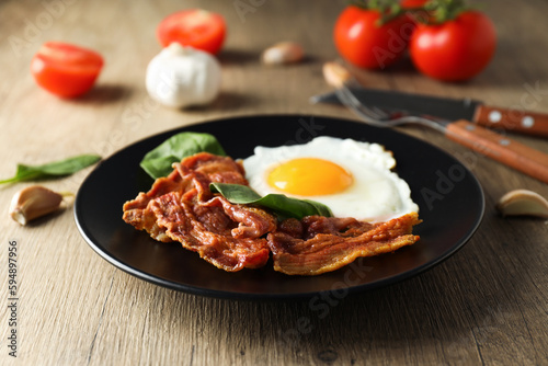 Fried bacon and egg - tasty breakfast composition