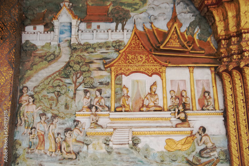 Beautiful Stucco on the Sim or Church architecture of Lan Xang style, there is a mural at Wat Mahathat or Wat That Noi "The Monastery of Stupa" and one of Luang Prabang's most beautiful temples.