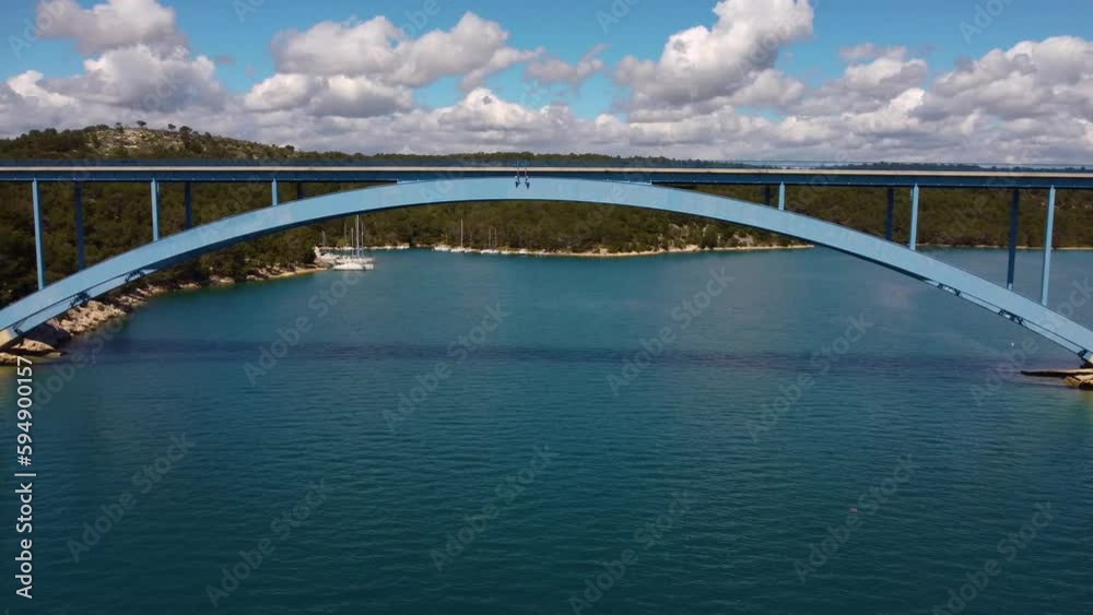 4K fast tracking shot, moving under Morinje Bridge (Croatia) and towards the bay area. 4K fast tracking shot, moving under Morinje Bridge (Croatia) and towards the bay area.