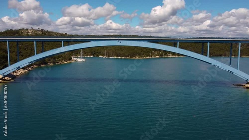 4K fast tracking shot, moving under Morinje Bridge (Croatia) and towards the bay area. photo