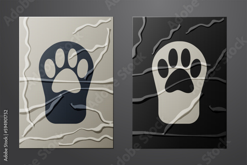 White Paw print icon isolated on crumpled paper background. Dog or cat paw print. Animal track. Paper art style. Vector