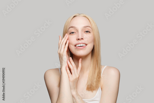 Joyful young smiling woman with healthy fresh skin. Facial treatment  skincare and cosmetology concept