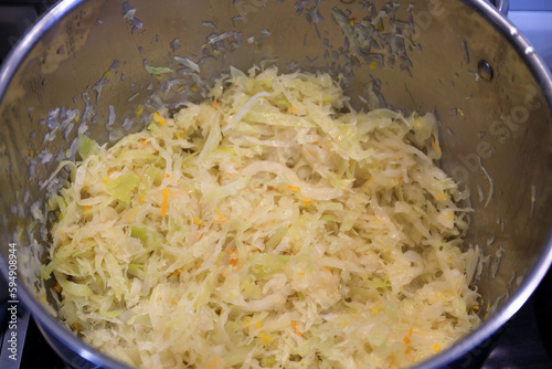 Chopped cabbage in a pot for bigos - a traditional Polish dish