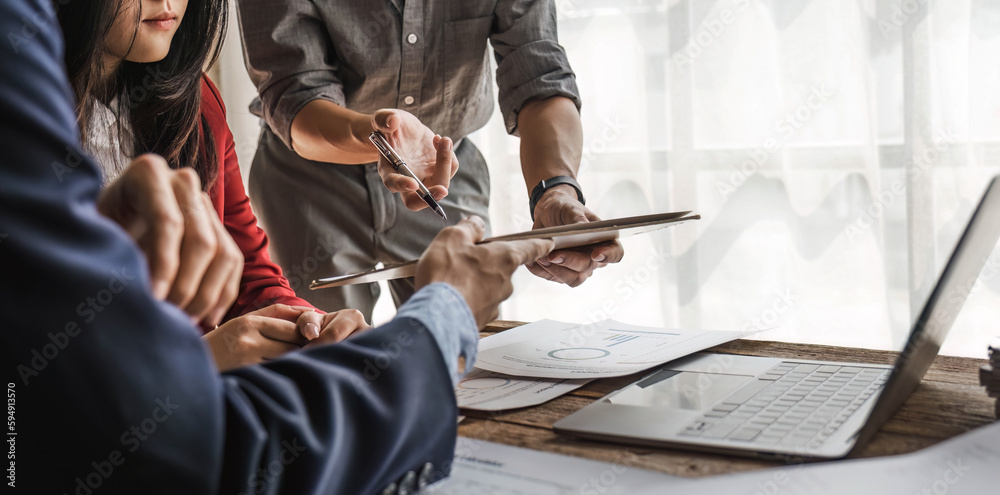 Fototapeta premium Business team meeting present.professional investor working with new startup project. Finance managers task.Digital tablet laptop computer design smart phone in office.