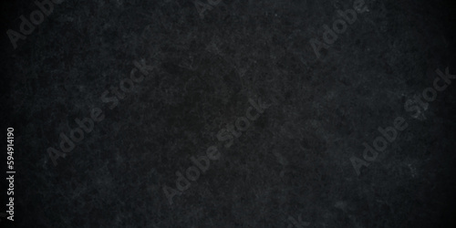 Dark black stone wall grunge backdrop texture background. monochrome slate grunge concrete wall black backdrop vintage marbled textured border background.