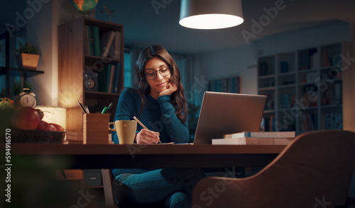 Woman studying late at night