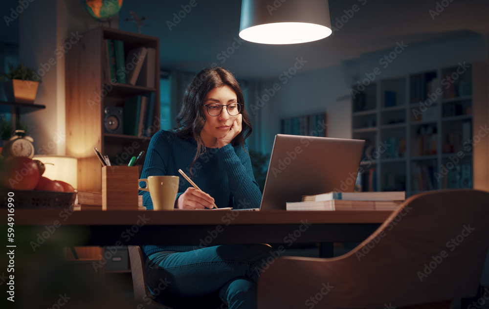Woman studying late at night Woman studying late at night