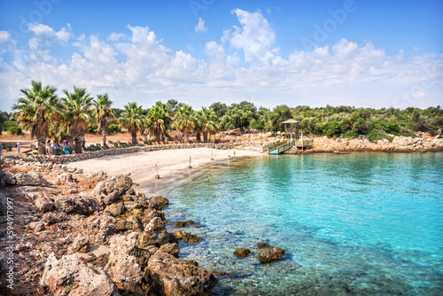 Fototapeta Naklejka Na Ścianę i Meble -  Sand and stone beach on Cleopatra island, Aegean sea, Marmaris, Türkiye