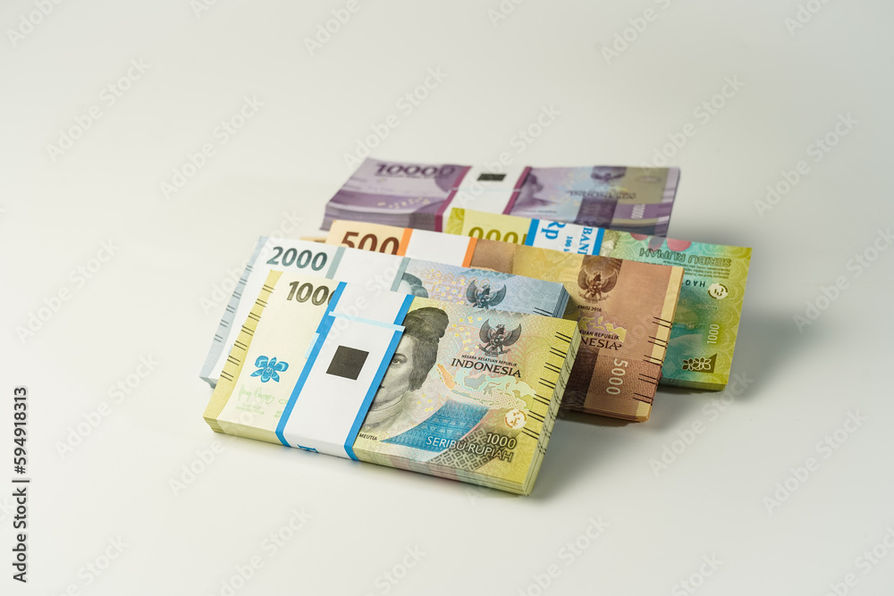 Jakarta, Indonesia, April 15, 2023, various bundles of Indonesian rupiah banknotes in the IDR currency thousands copy space thr zakat Jakarta, Indonesia, April 15, 2023, various bundles of Indonesian rupiah banknotes in the IDR currency thousands copy space thr zakat
