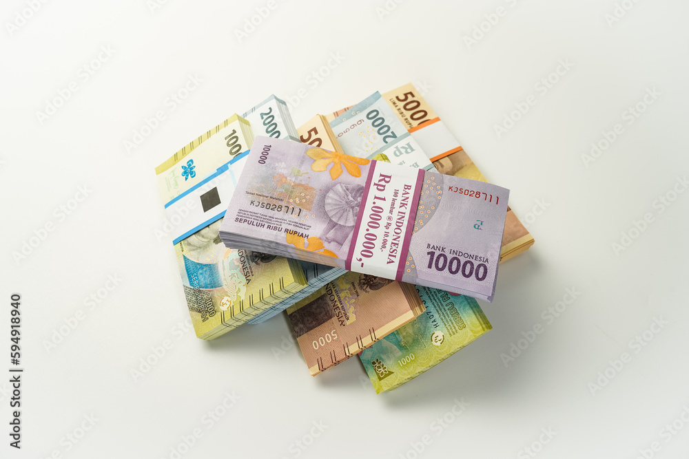 Jakarta, Indonesia, April 15, 2023, various bundles of Indonesian rupiah banknotes in the IDR currency thousands copy space thr zakat Jakarta, Indonesia, April 15, 2023, various bundles of Indonesian rupiah banknotes in the IDR currency thousands copy space thr zakat