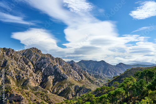 Mountain landscape with dramatic clouds in the Sierras de Tejada, Province of Malaga, Andlusia, Spain