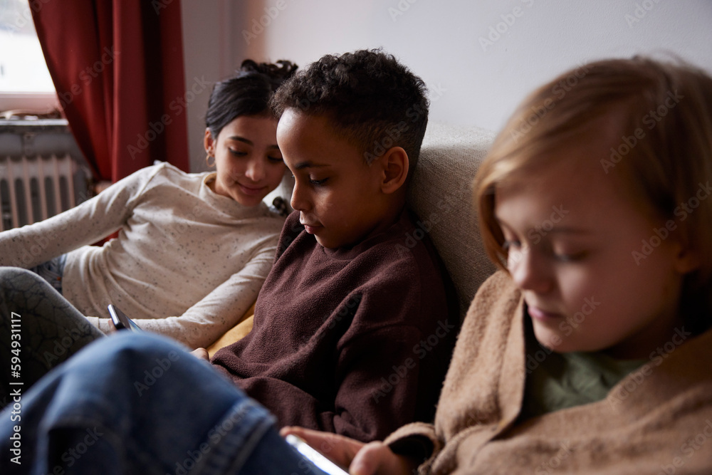 Children using phones at home Children using phones at home