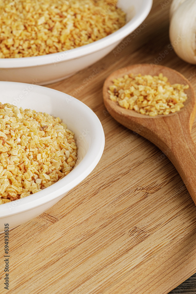 Minced Garlic isolated on a wooden background Minced Garlic isolated on a wooden background