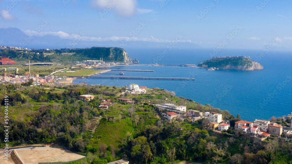 Aerial view of the island of Nisida. It is located in Naples, Italy. Nisida is a volcanic islet of the Flegrean Islands archipelago. It is connected to the city by a long pier.