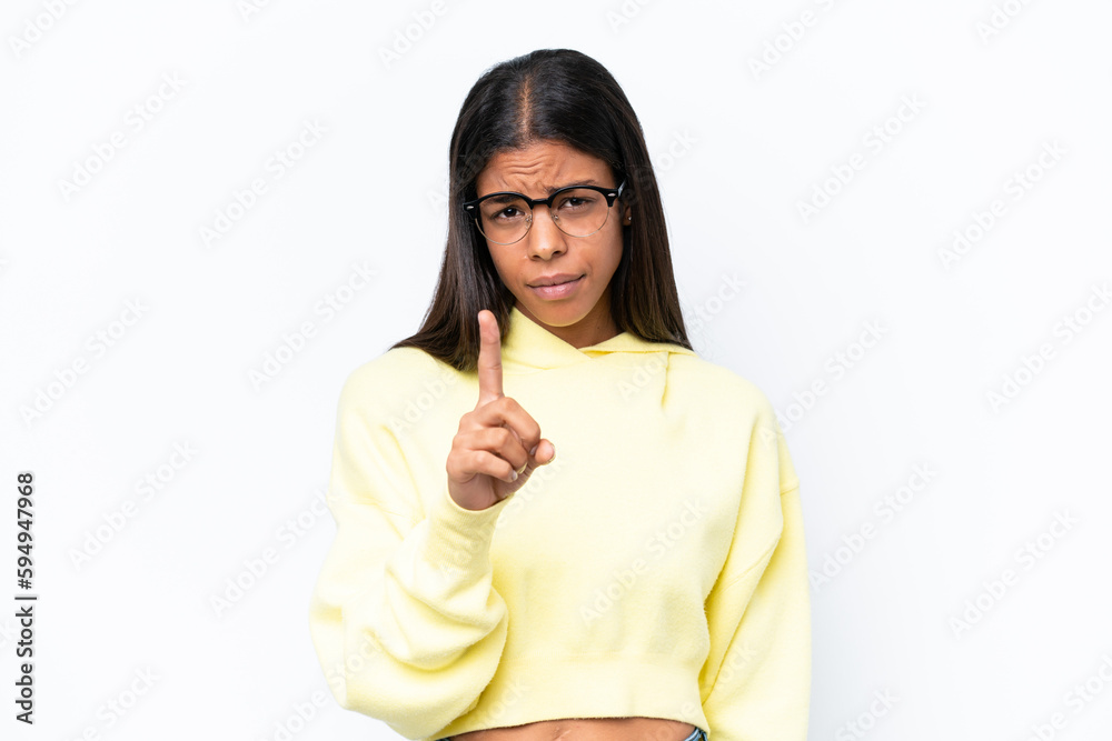 Fototapeta premium Young African american woman isolated on white background frustrated and pointing to the front