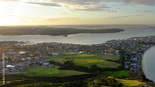Drone view over a residential area on a coastline in Auckland, New Zealand photo