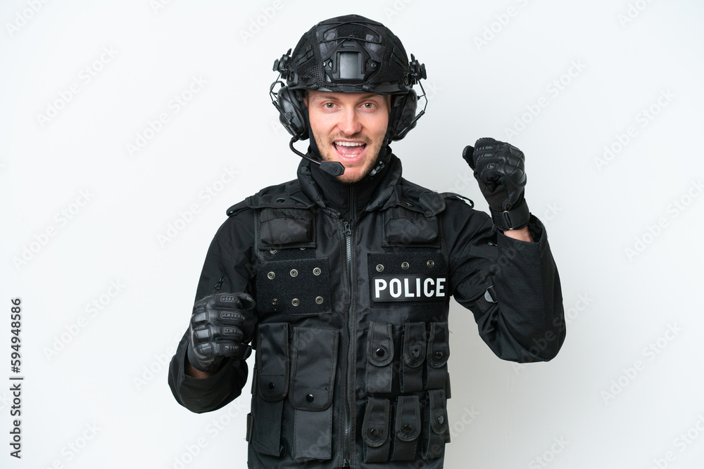 SWAT man over isolated white background celebrating a victory SWAT man over isolated white background celebrating a victory